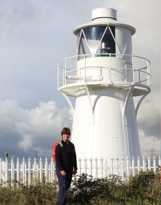 self portait, Ruth by lighthouse, walking through Newport Wetlands, Wales