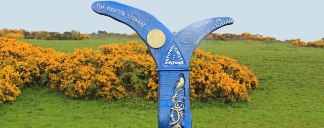 09 National Cycle Network 7 sign, Ruth hiking to Newton Stewart